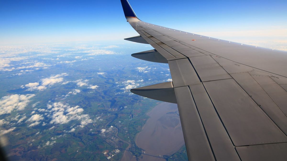 Clouds and land seen from an aeroplane window